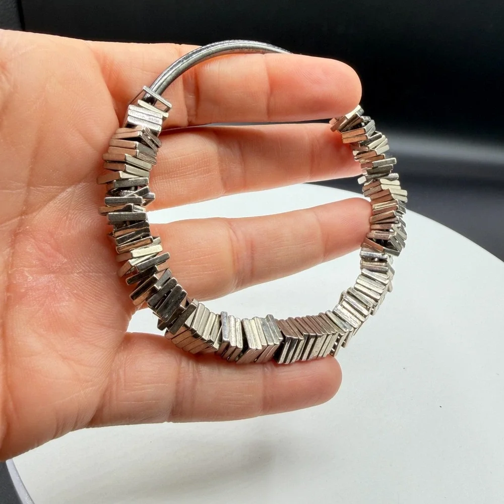N/A sculptural silver